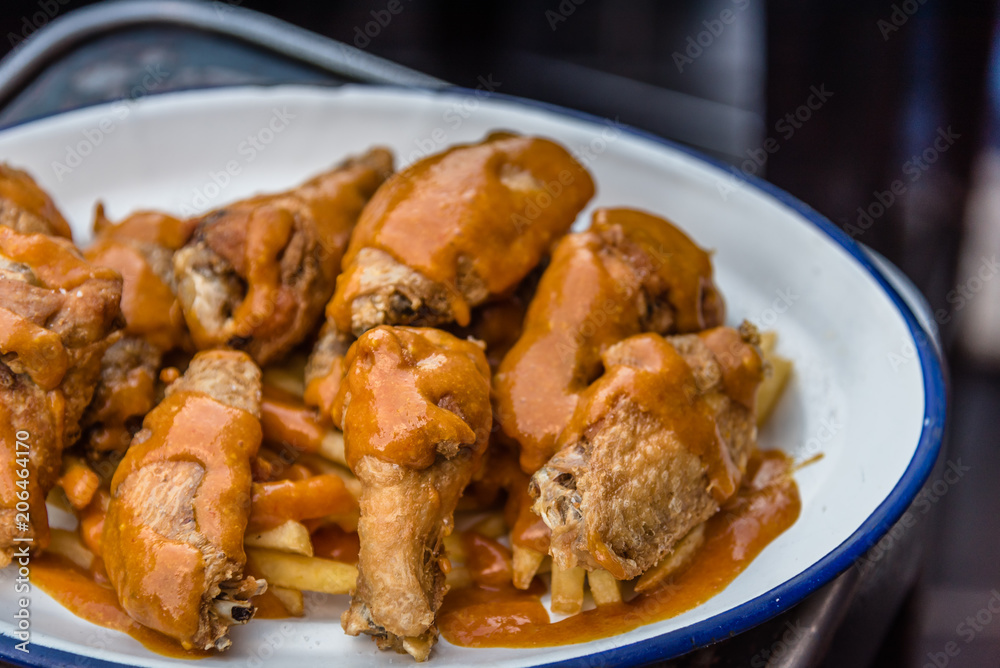 Spicy chicken wings in tapas bar Spicy chicken wings in tapas bar