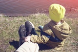 kid resting with father outdoors
