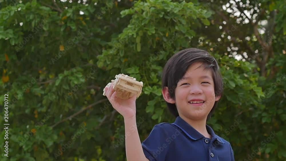 Cute asian child playing model cars slow motion 3 Cute asian child playing model cars slow motion 3