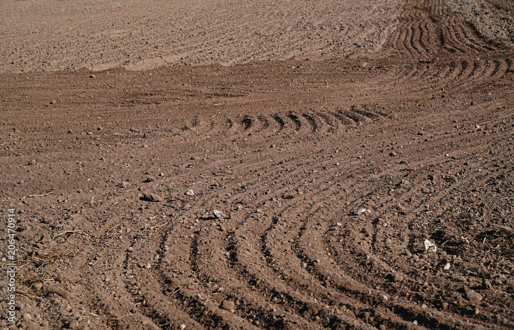Plowed agriculture field, brown soil Plowed agriculture field, brown soil