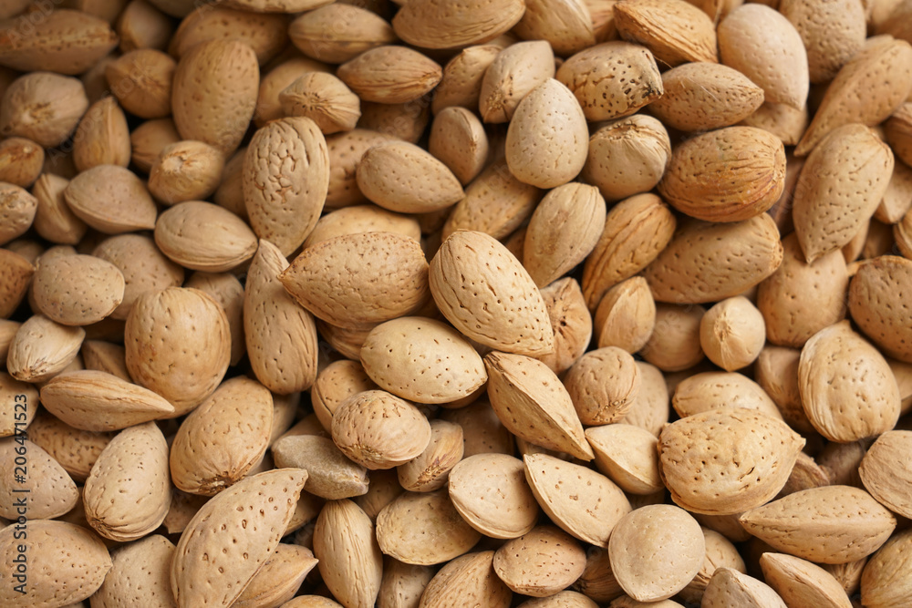 Obraz premium Raw many almonds as background