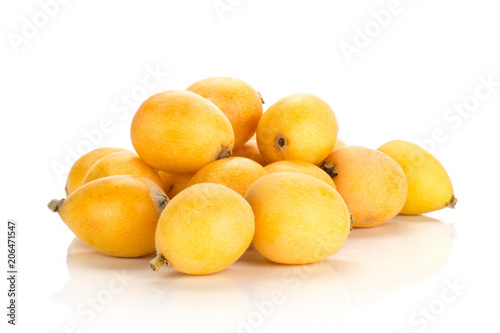 Fresh Japanese loquats stack isolated on white background.