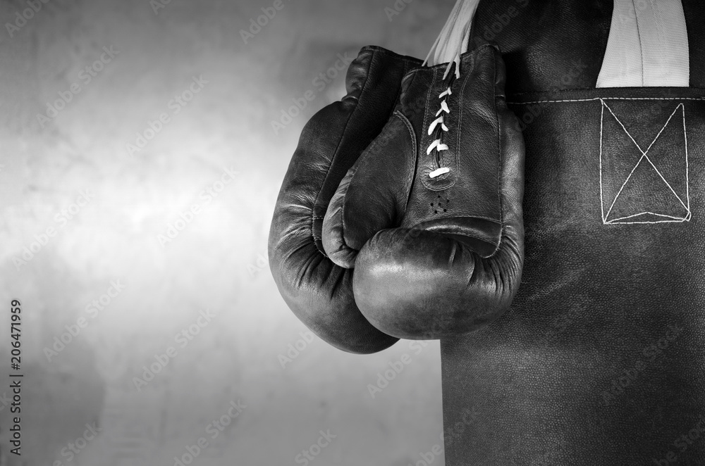 Boxing background with hanging boxing gloves Stock Photo | Adobe Stock