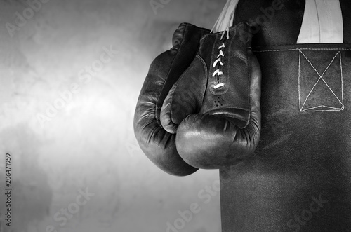 Boxing background with hanging boxing gloves © Ramilon Stockphoto