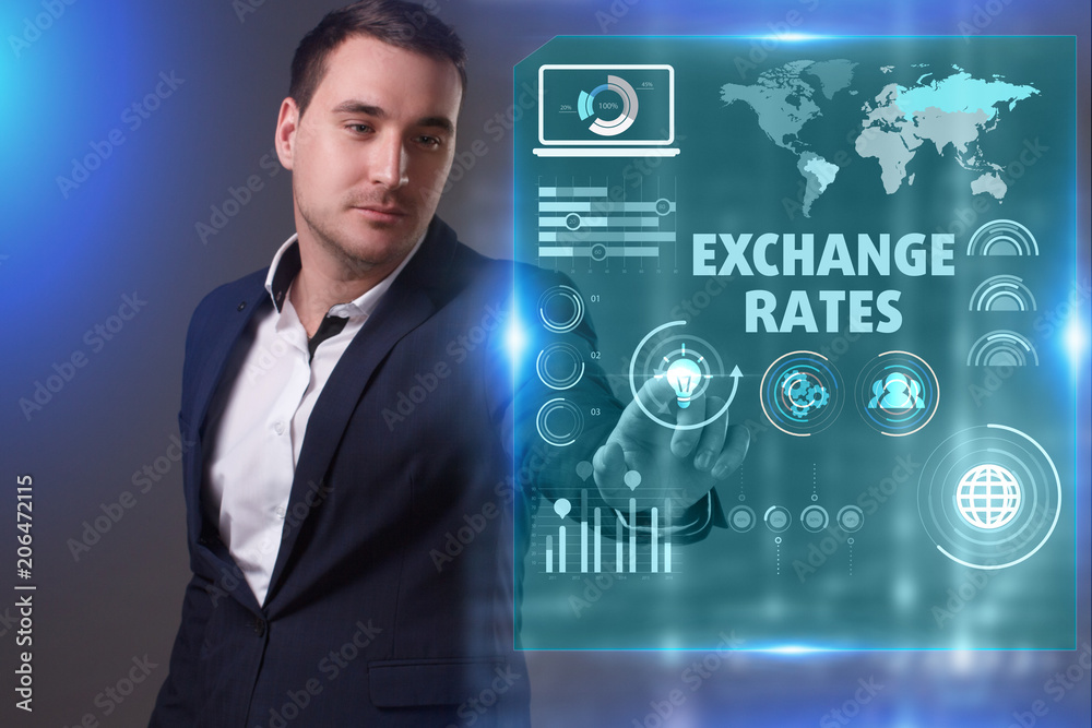 Business, Technology, Internet and network concept. Young businessman working on a virtual screen of the future and sees the inscription: Exchange rates Business, Technology, Internet and network concept. Young businessman working on a virtual screen of the future and sees the inscription: Exchange rates
