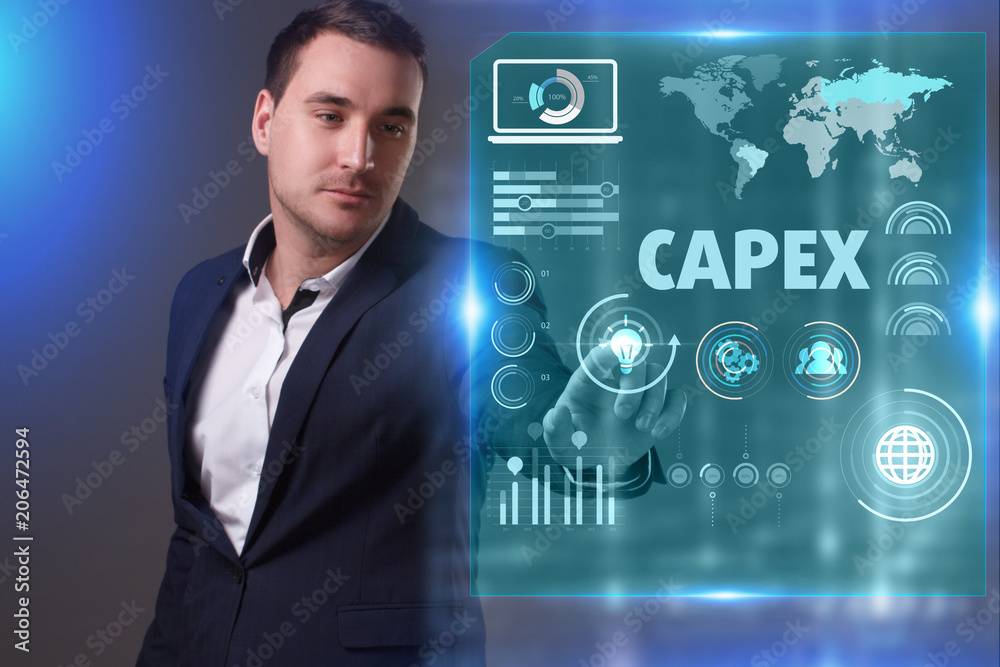 Business, Technology, Internet and network concept. Young businessman working on a virtual screen of the future and sees the inscription: Capex Business, Technology, Internet and network concept. Young businessman working on a virtual screen of the future and sees the inscription: Capex
