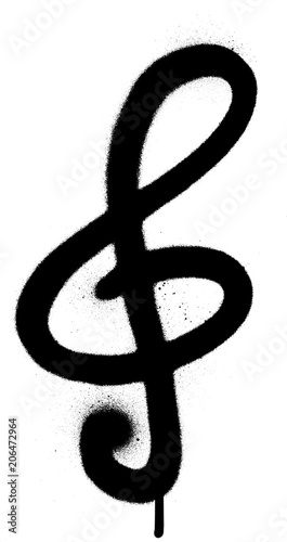 graffiti sprayed treble clef in black over white