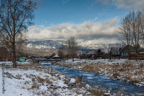 a mountain stream flows at the foot of the Zigalga Range