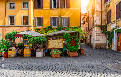 View of old cozy street in Trastevere in Rome, Italy.  Trastevere is rione of Rome, on the west bank of the Tiber in Rome, Lazio, Italy.  Architecture and landmark of Rome