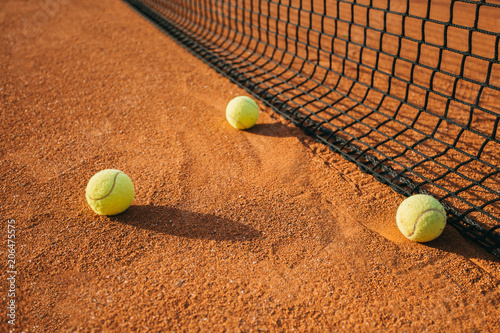 Tennis balls on tennis court.