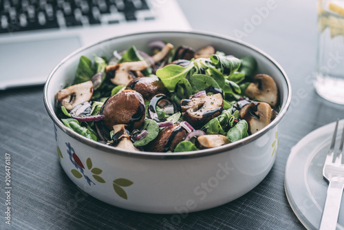 Lunch box with field salad, onions, roasted mushrooms, onions and balsamic photo