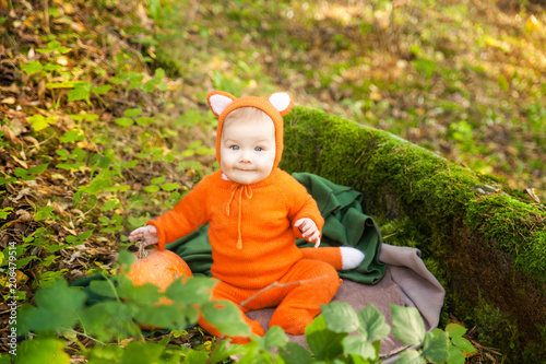 Cute baby girl dressed in fox costume