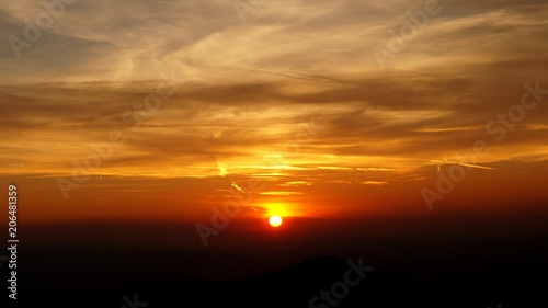 A very vibrant sunset on a  mountain © Marko