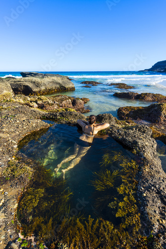 Woman swin in nature pool Sydney sea.