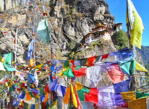 Colorful Buddhist prayer flags at Taktshang Goemba or Tiger's nest monastery in Paro, Bhutan © wanchanta