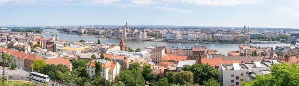 Wide panorama overview of Budapest the capical of Hungary with Hungarian Parliament and Danube River. Budapest european cityscape.