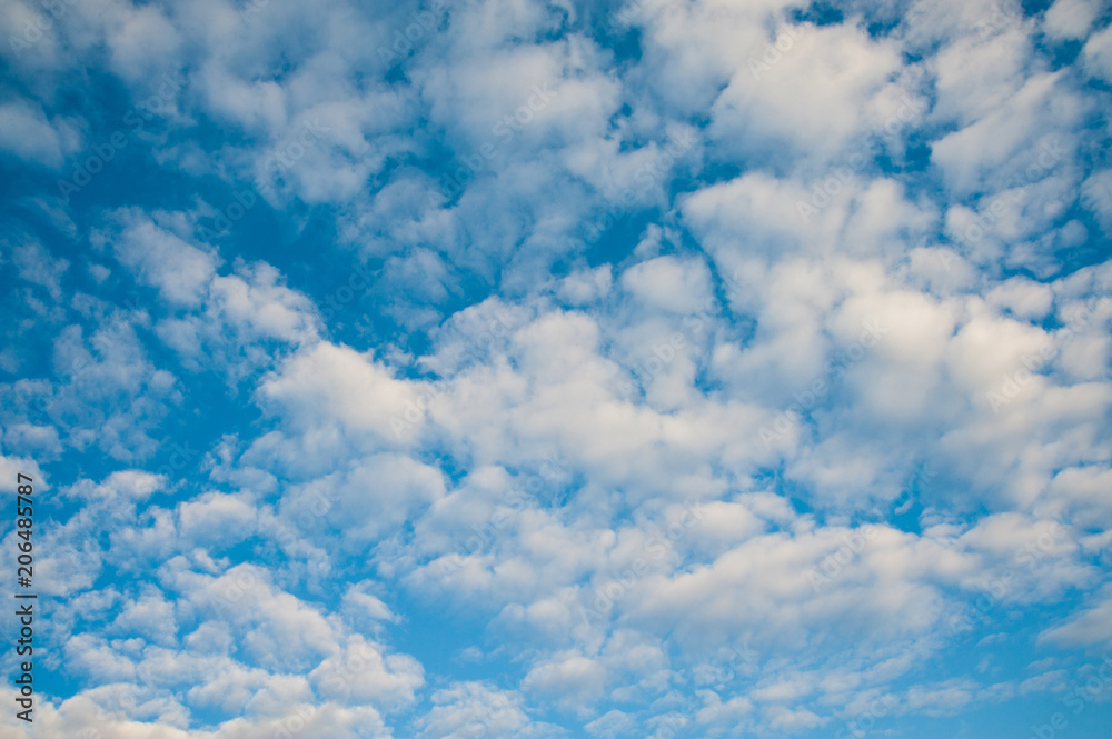 White fluffy clouds in deep blue sky White fluffy clouds in deep blue sky