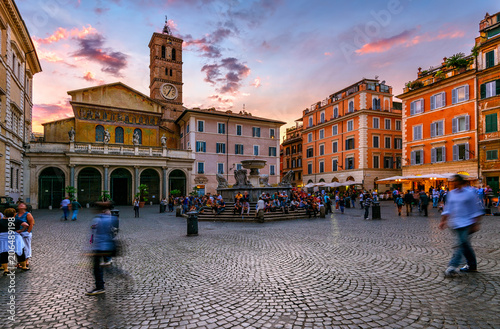 Fototapeta Naklejka Na Ścianę i Meble -  Basilica di Santa Maria in Trastevere and Piazza di Santa Maria in Trastevere at sunset, Rome, Italy. Trastevere is rione of Rome, on west bank of Tiber in Rome. Architecture and landmark of Rome