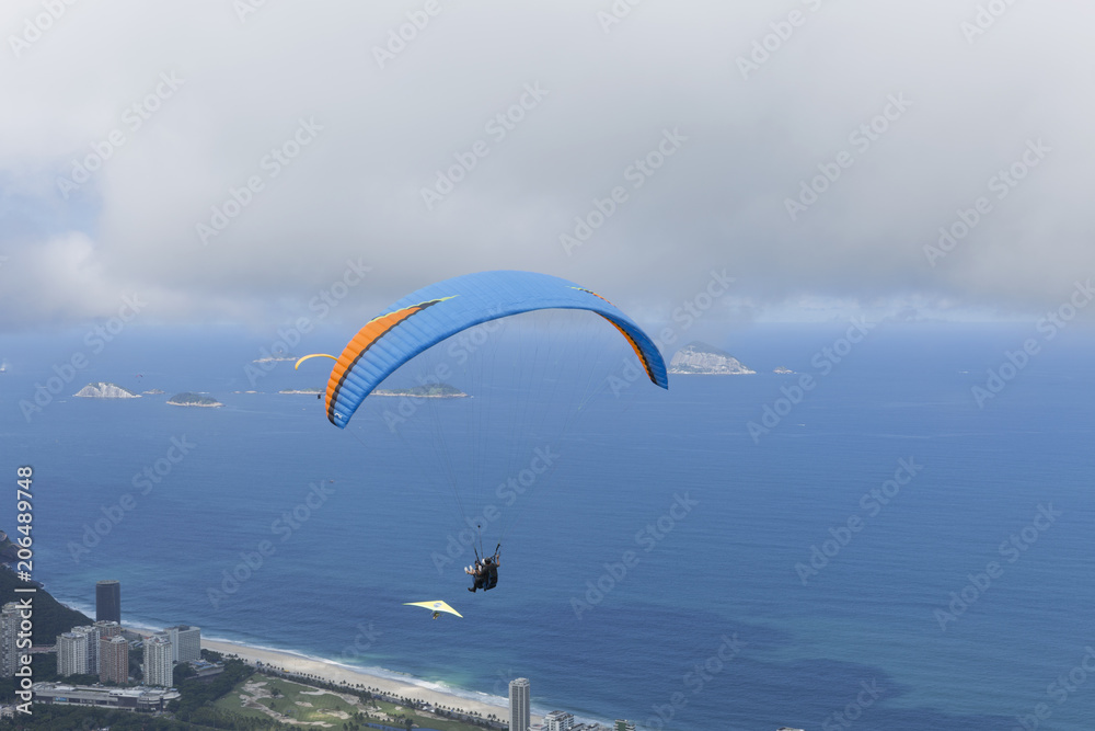 Paraglider flying over Sao Conrado in Rio de Janeiro. Paraglider flying over Sao Conrado in Rio de Janeiro.