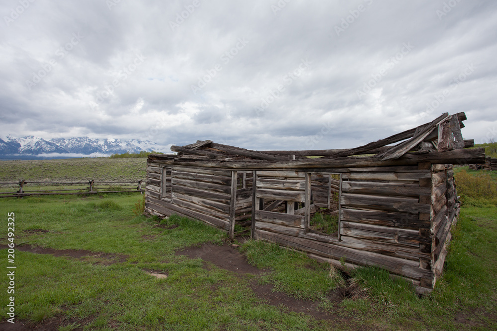 Log Cabin Barn in front of Mountains in the Grand Teton National Park