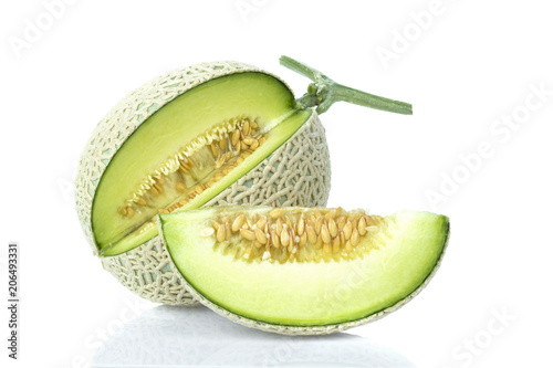 whole and slice of japanese melons, green melon or cantaloupe melon with seeds isolated on white background