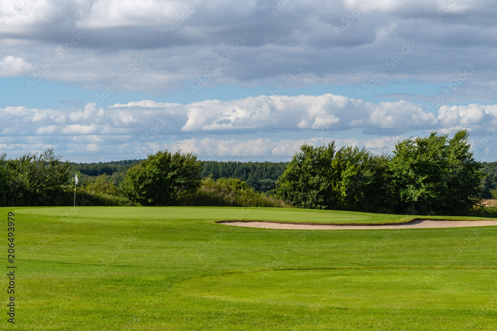 Green With Flag On A Golf Course