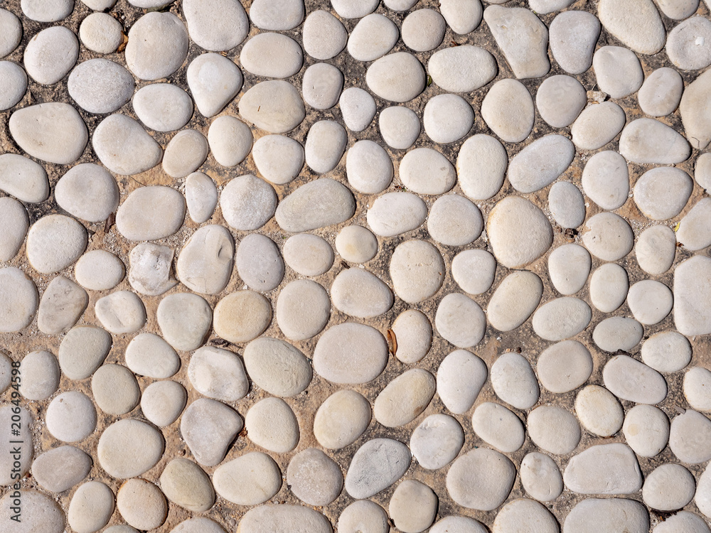 Paving from sea pebbles. Background, texture Paving from sea pebbles. Background, texture