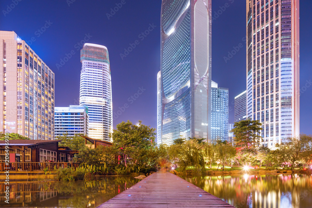 street and skyscrapers of a modern city at night