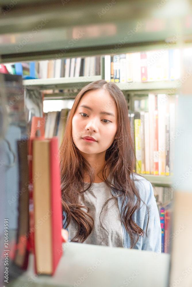 pretty woman happy to read and research in library pretty woman happy to read and research in library