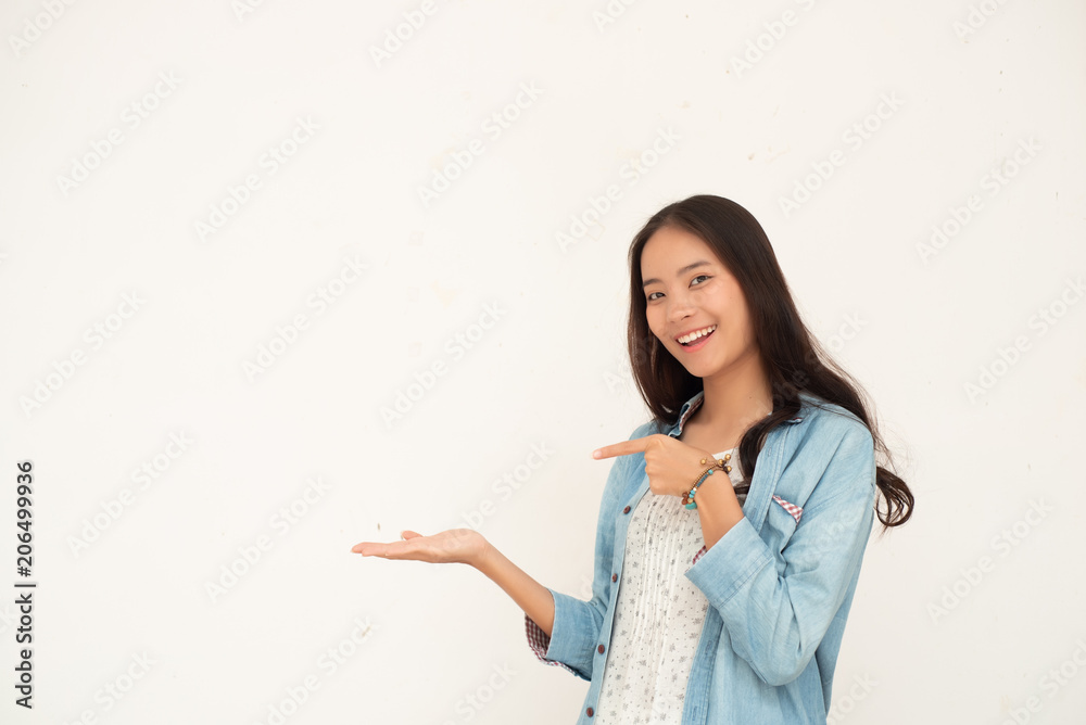 Beautiful women use their hands to point and offer something for invitations and promote. Beautiful women use their hands to point and offer something for invitations and promote.