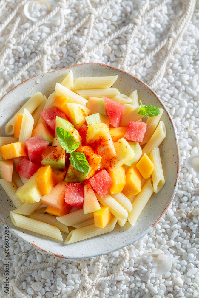 Sweet penne with melon, papaya and pineapple Sweet penne with melon, papaya and pineapple