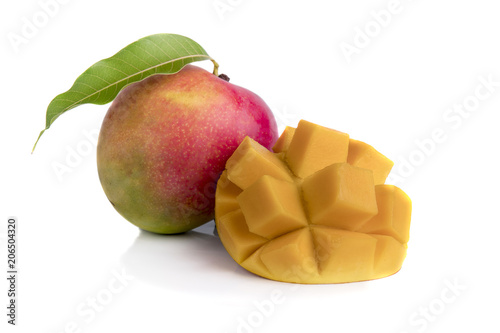 Mango fruit decorated with leaves isolated on white background