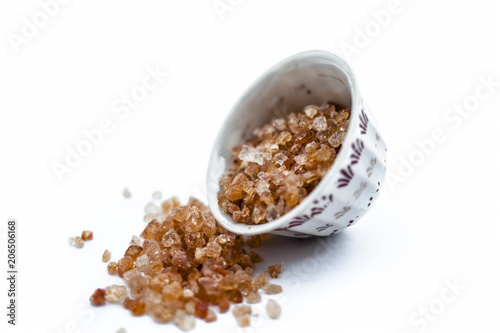 Gond katira or edible gum or common gum in a bowl isolated on white. photo