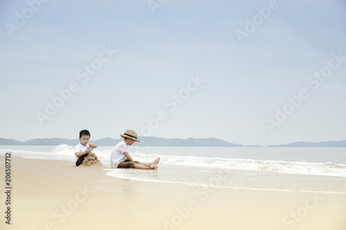 happy family with two kids on the beach, © aedkafl