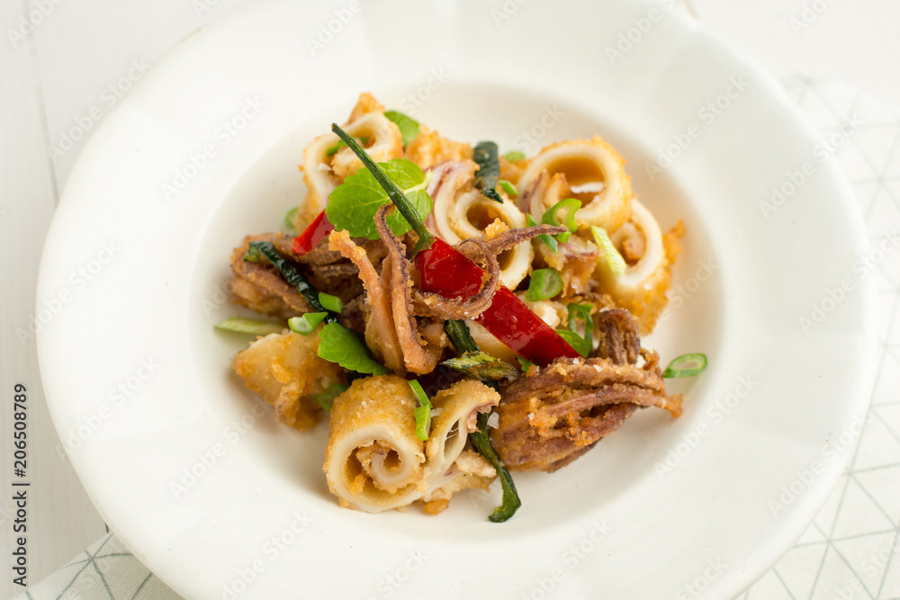 Fried Squids Tentacle Calamari with Chili Pepper and Mint Leaves Fried Squids Tentacle Calamari with Chili Pepper and Mint Leaves