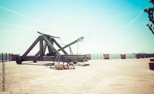 Canvas Print ancient catapult on the ramparts of Alghero