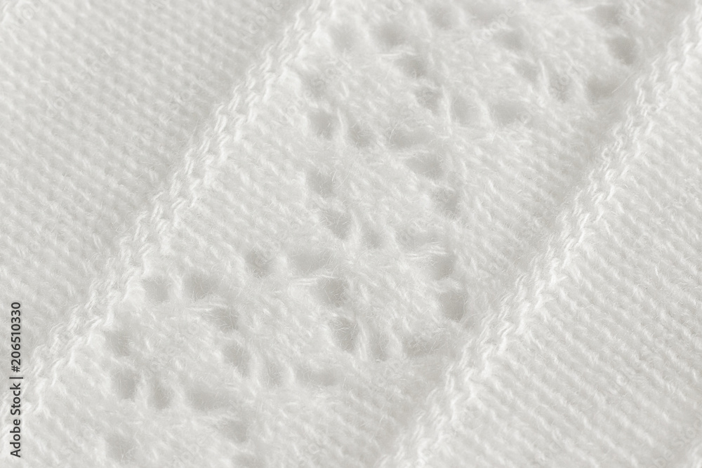 Knitted fabric with an openwork pattern, handmade. Background, texture Knitted fabric with an openwork pattern, handmade. Background, texture