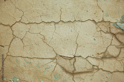 Texture light plastered wall with cracks