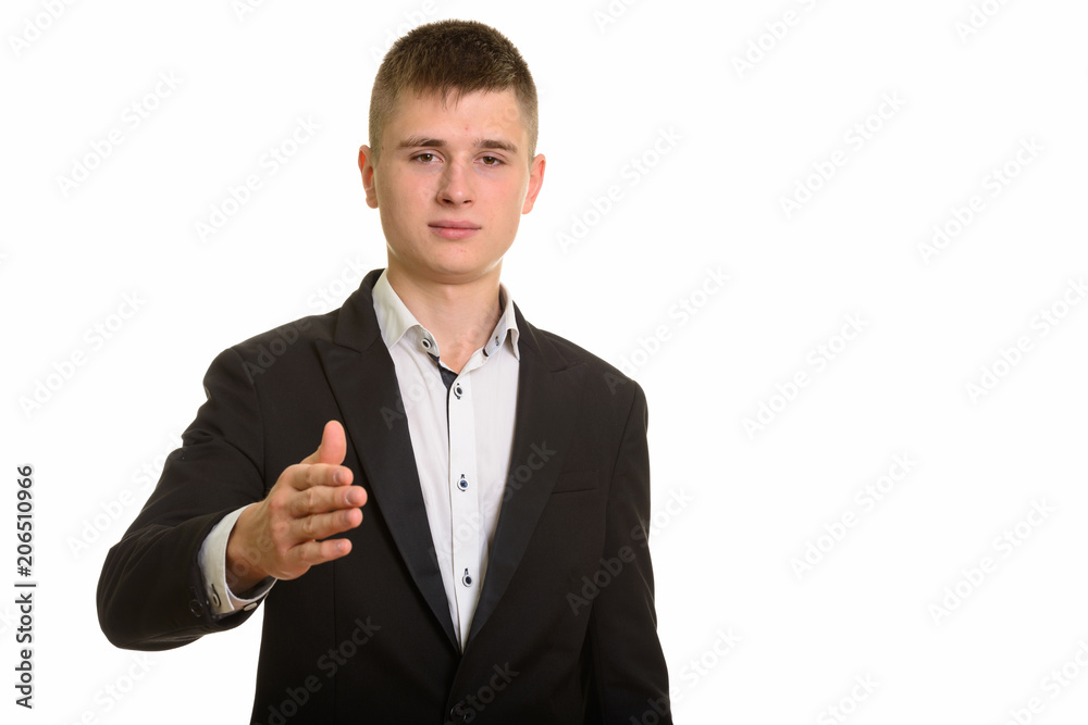 Studio shot of young businessman giving handshake Studio shot of young businessman giving handshake