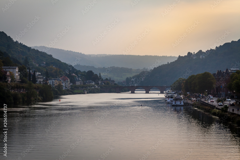 a view of river Necker on a sunny cloudy autumn morning in Heidelberg, Germany
