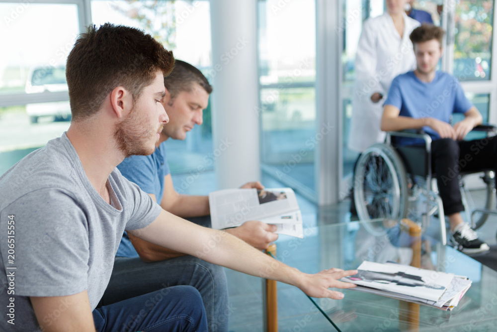 men waiting for doctor appointment men waiting for doctor appointment