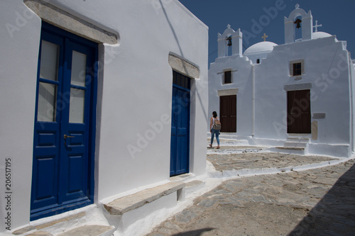 Fototapeta Naklejka Na Ścianę i Meble -  Amorgos,Greece-August 4 ,2017through the narrow streets and the multicolored doors leading to the castle of Chora in Amorgos