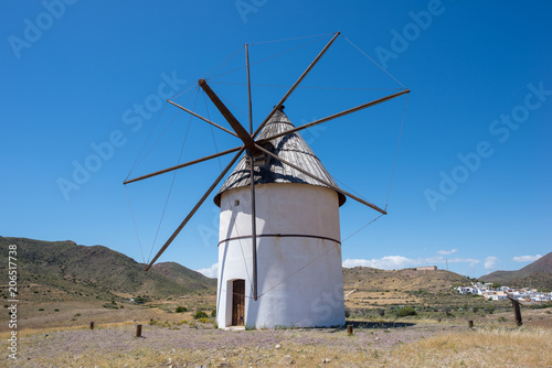 Windmill under blue sky in Almeria, Andalucia