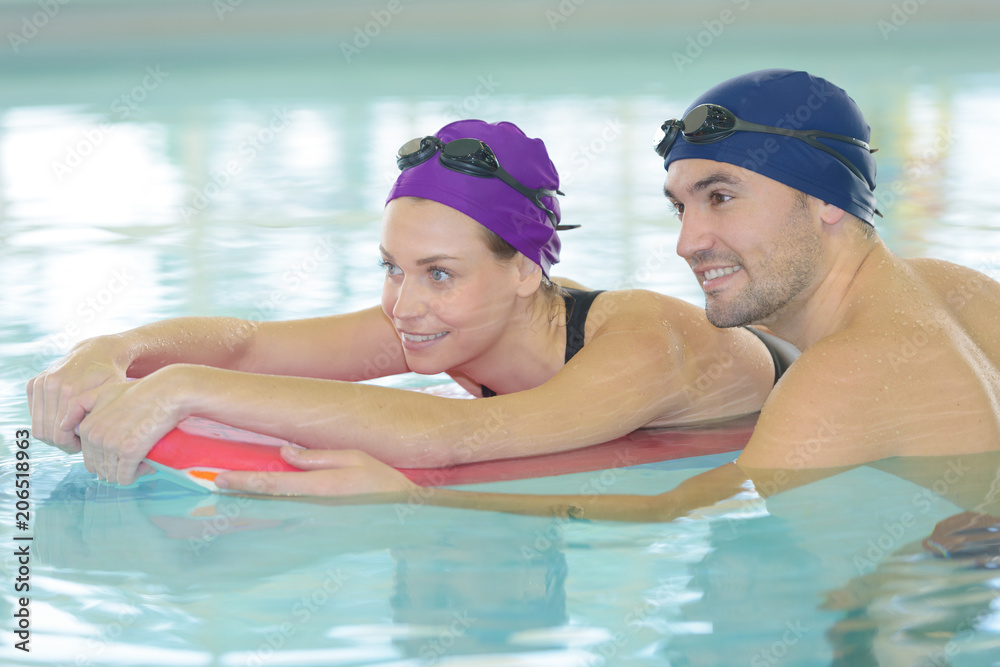 couple swimming in the pool