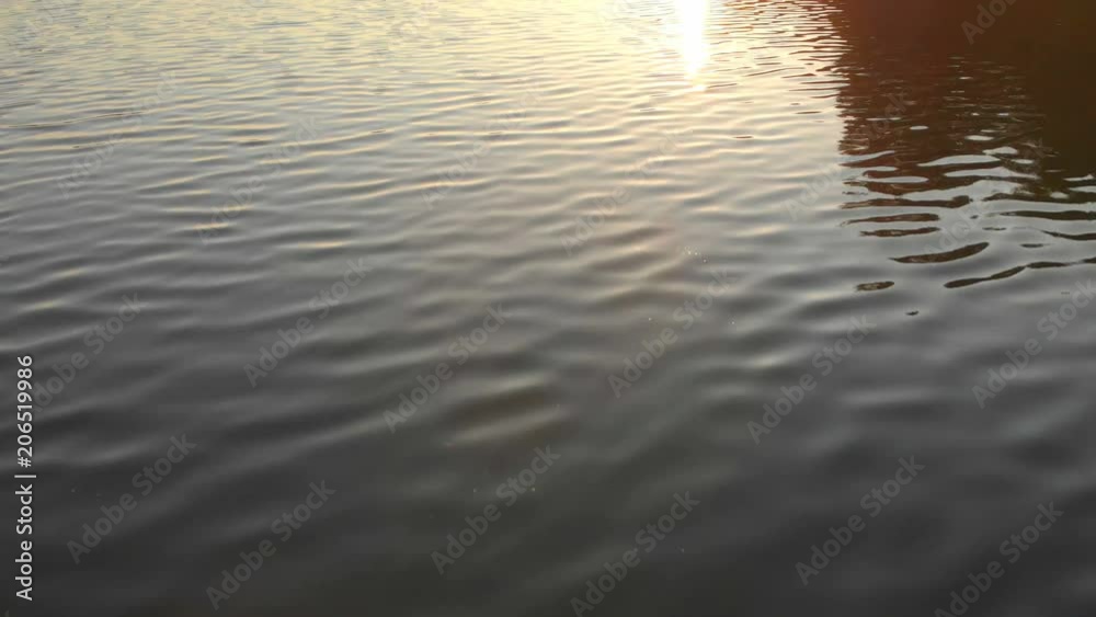 Sunset over the lake, flying over the edge of the water, shooting from the air with a drone. Sunset over the lake, flying over the edge of the water, shooting from the air with a drone.