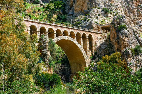 stone railway bridge in the village of el chorro at the end of trail of Caminito Del Rey
