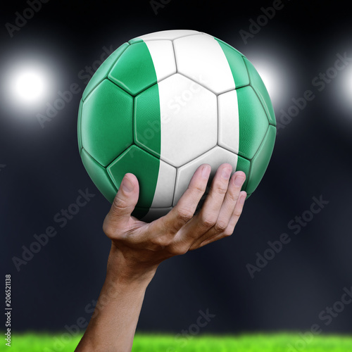 Man holding Soccer ball with Nigerian flag