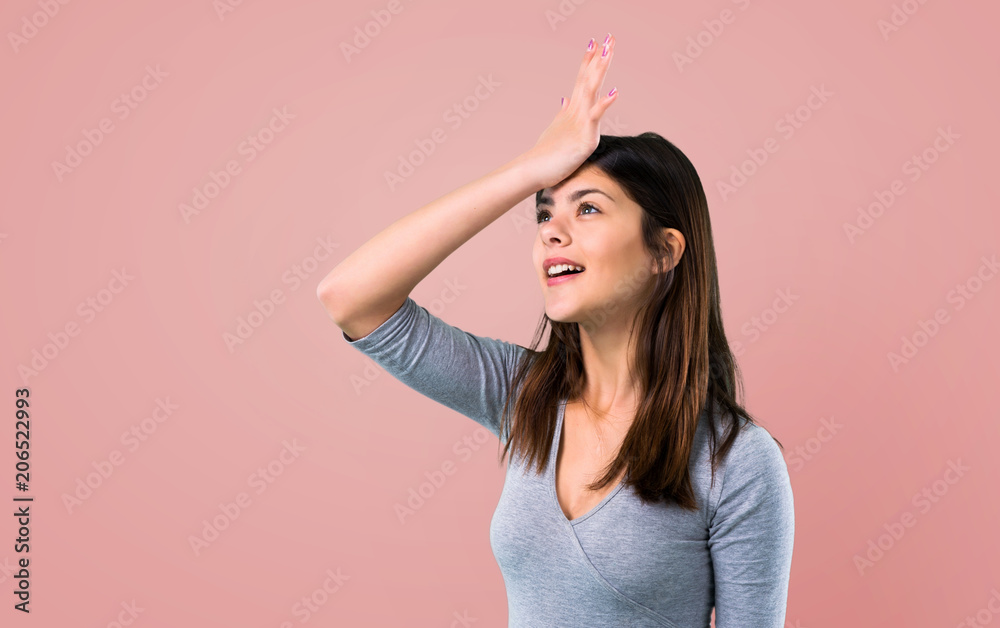 Teenager girl intending to realizes the solution on pink background Teenager girl intending to realizes the solution on pink background