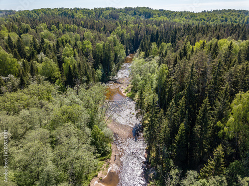 drone image. aerial view of rural area with river in forest