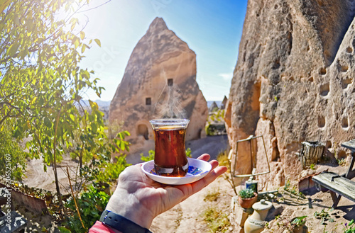 Morning cup of tea with Red valley and rocks background view   , Goreme , Cappadocia, Central Anatolia,Turkey